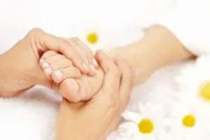 Reflexology treatment on the feet