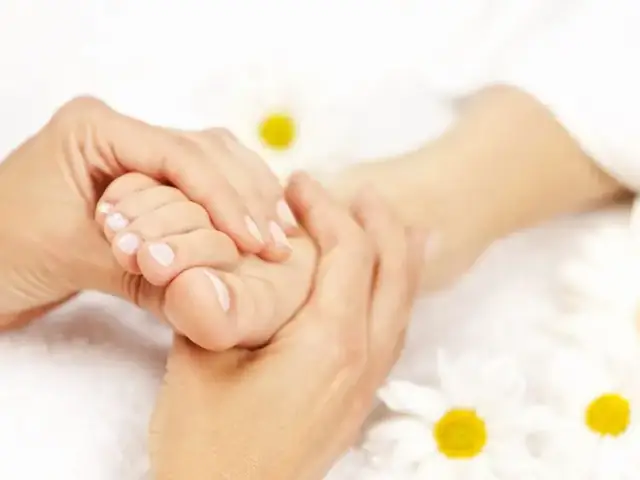 Reflexology treatment on the feet